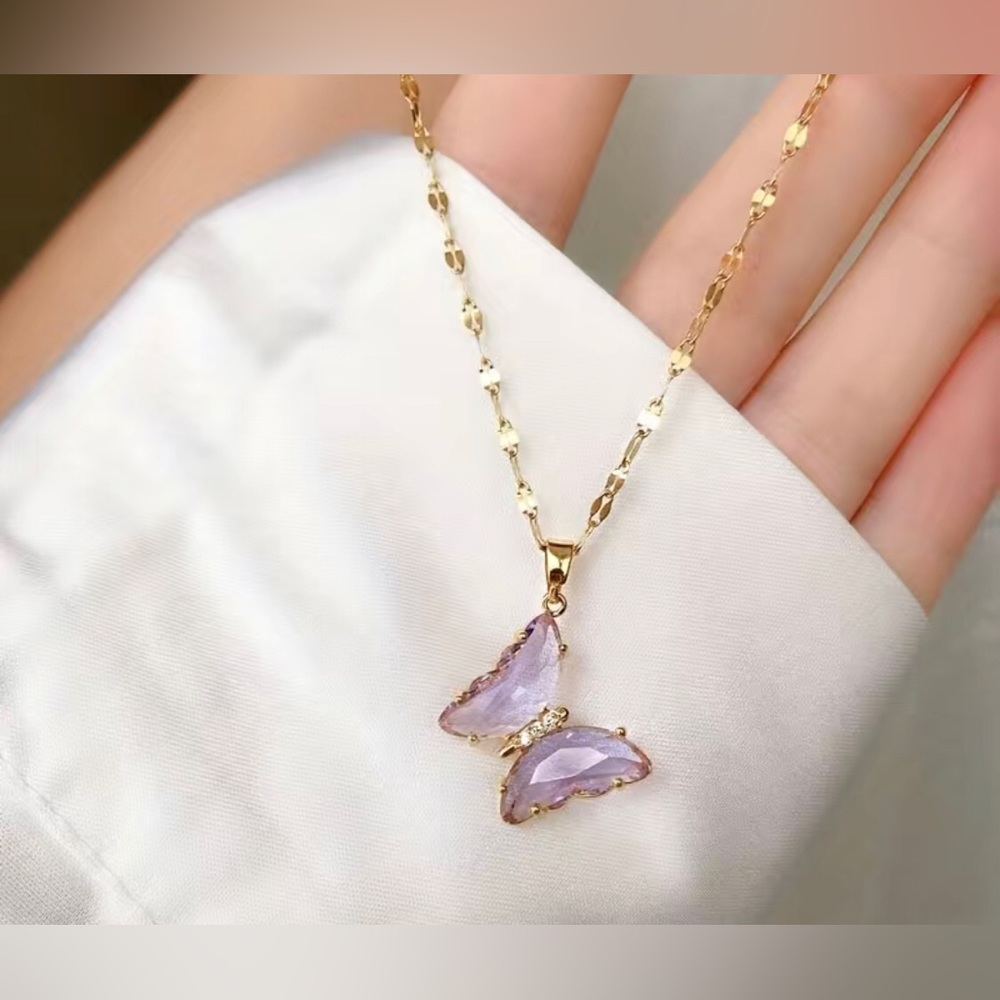 Brand new still in bag never worn butterfly necklace in lavender. 🦋